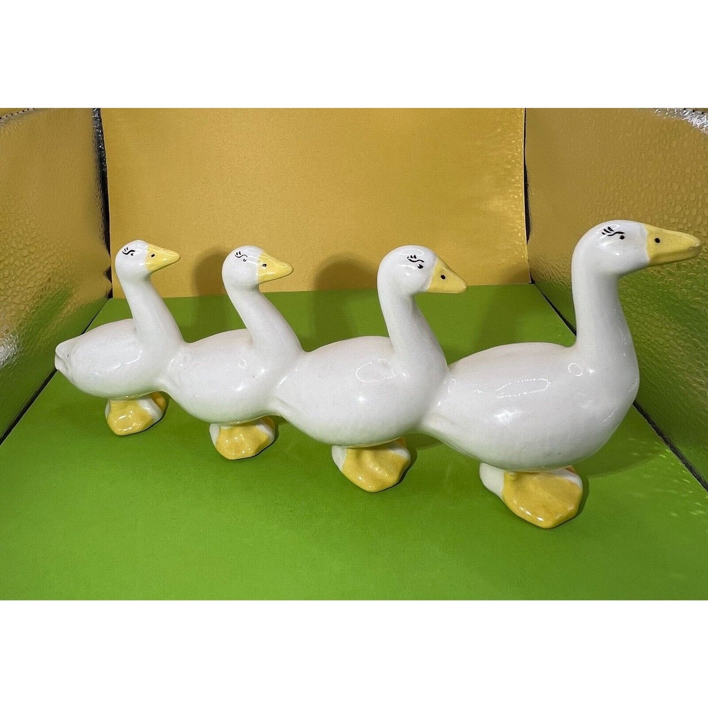 Four attached White Ducks in a Row Ceramic Descending Size Eyelashes