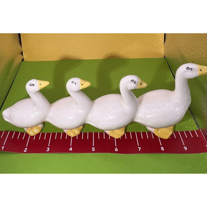 Four attached White Ducks in a Row Ceramic Descending Size Eyelashes