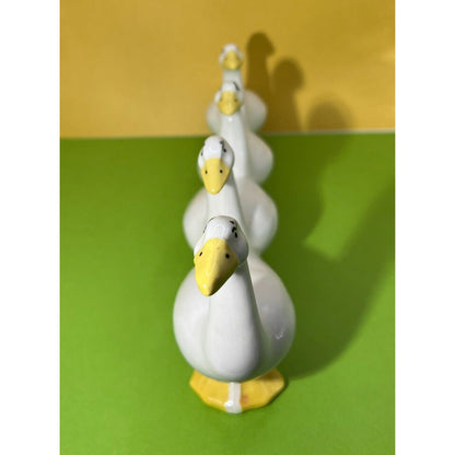 Four attached White Ducks in a Row Ceramic Descending Size Eyelashes