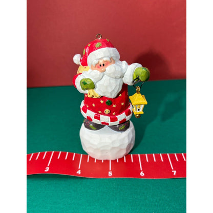 Santa holding a swinging lantern Christmas Decoration