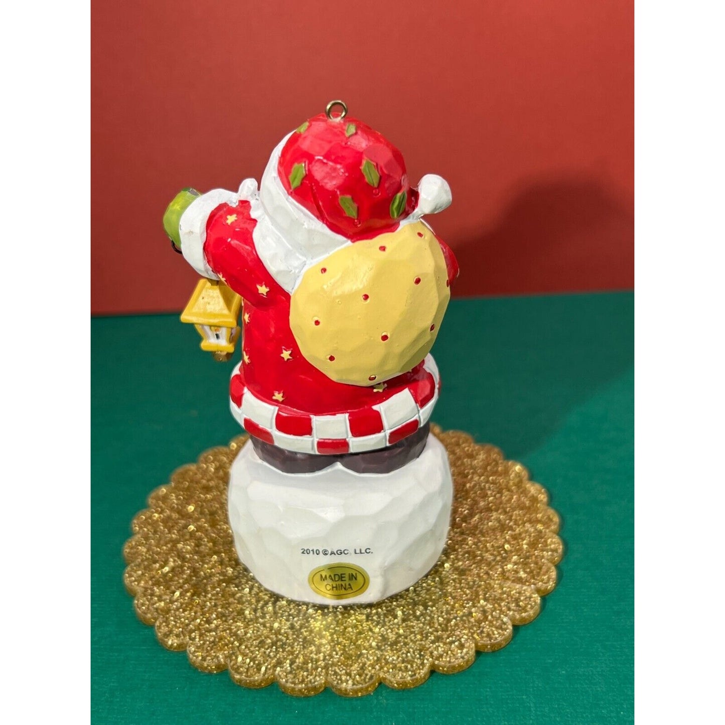 Santa holding a swinging lantern Christmas Decoration