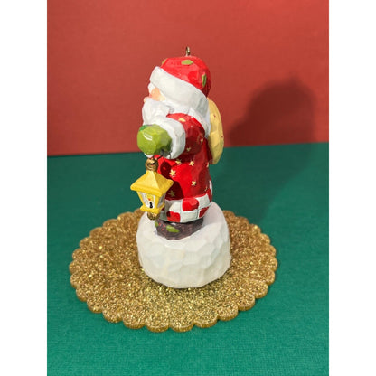 Santa holding a swinging lantern Christmas Decoration