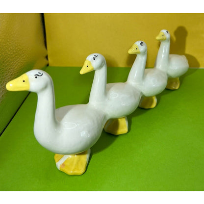 Four attached White Ducks in a Row Ceramic Descending Size Eyelashes